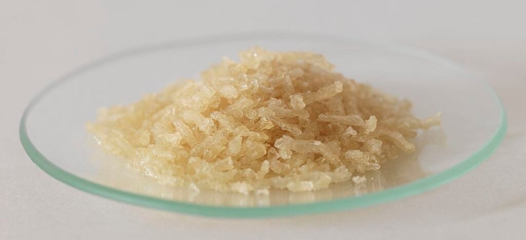 Gelatin flakes on a clear crystal plate